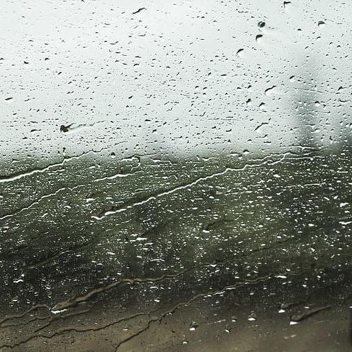 view from the train window while it's raining to descrive the vibe of playlist number three